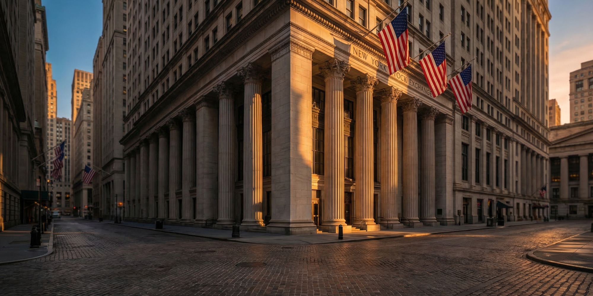 New York Stock Exchange building on Wall Street at dawn, golden hour light, empty financial district streets