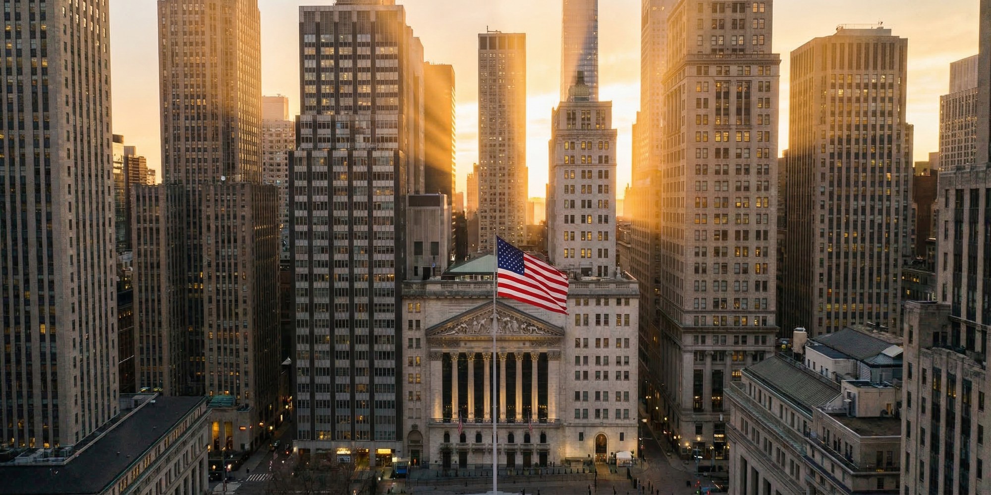 New York Stock Exchange and Wall Street financial district at dusk, golden hour light
