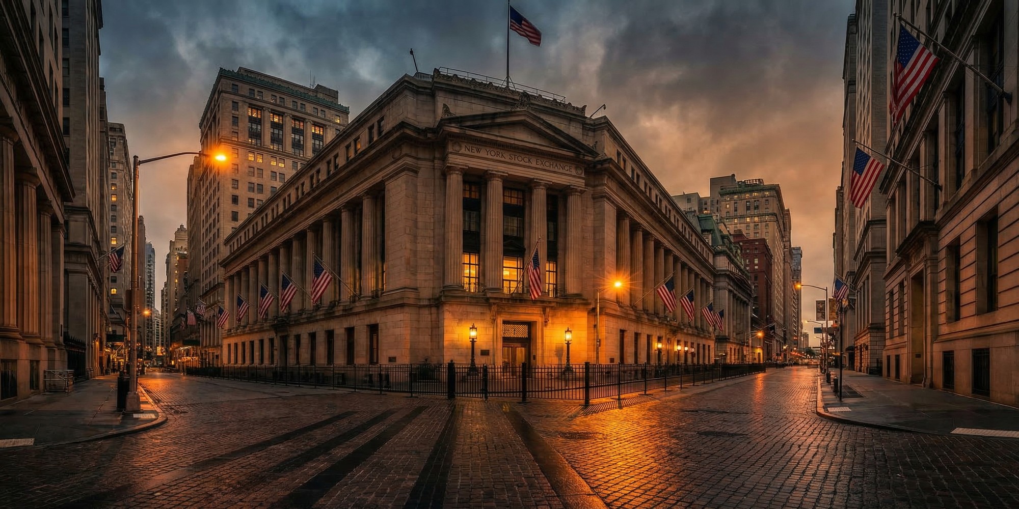Wall Street financial district at dusk, New York Stock Exchange neoclassical building exterior with American flags, amber street lighting and atmospheric overcast sky